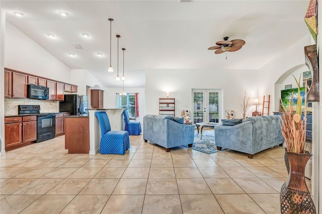 tiled living room with vaulted ceiling and ceiling fan