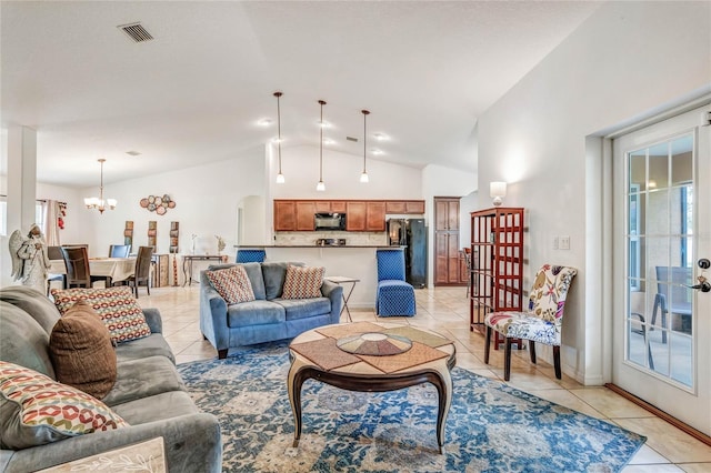 tiled living room with lofted ceiling and a notable chandelier