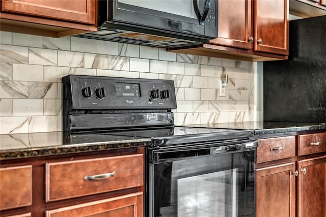 kitchen featuring decorative backsplash, dark stone counters, and black appliances