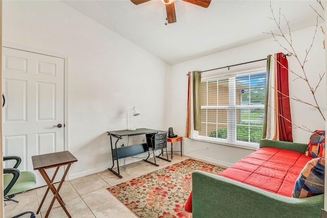 interior space with ceiling fan, tile patterned flooring, and lofted ceiling