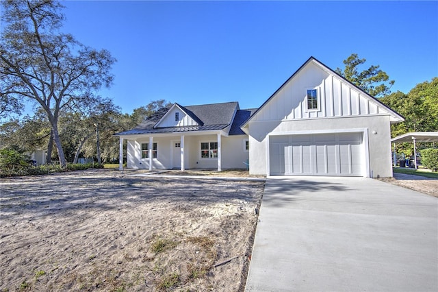 view of front of house featuring covered porch and a garage