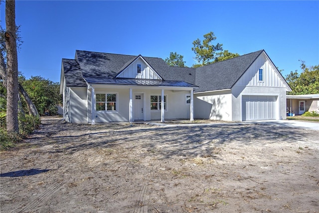 view of front of house featuring covered porch and a garage