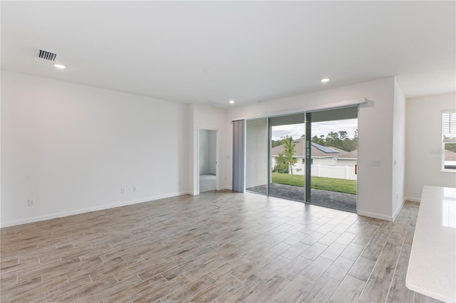 spare room featuring light wood-type flooring