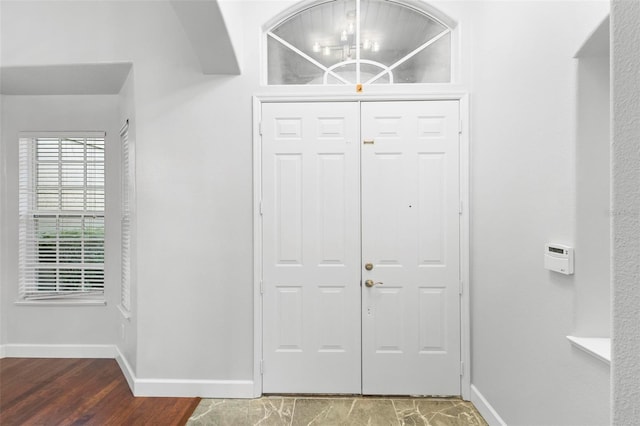 entryway with wood-type flooring