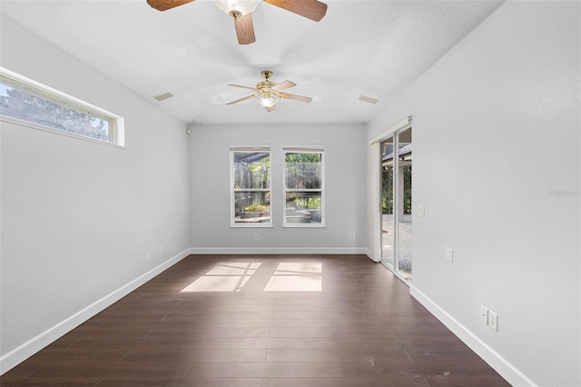 spare room with ceiling fan and dark hardwood / wood-style flooring