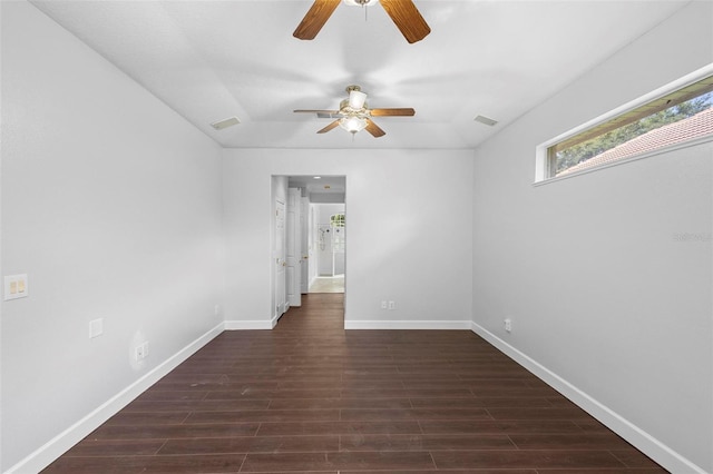 empty room featuring ceiling fan and dark hardwood / wood-style floors