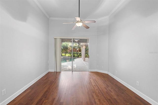 spare room with dark wood-type flooring, ornamental molding, and ceiling fan