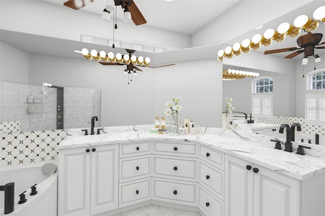 bathroom with vanity, a washtub, and ceiling fan