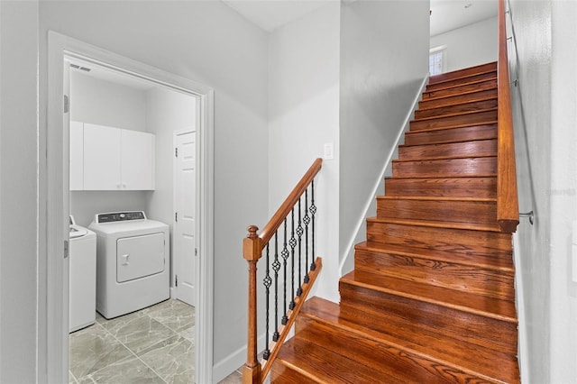 staircase with washer and dryer