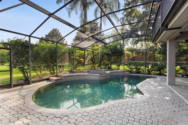 view of swimming pool with a lanai and a patio