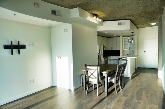 dining area with dark hardwood / wood-style floors