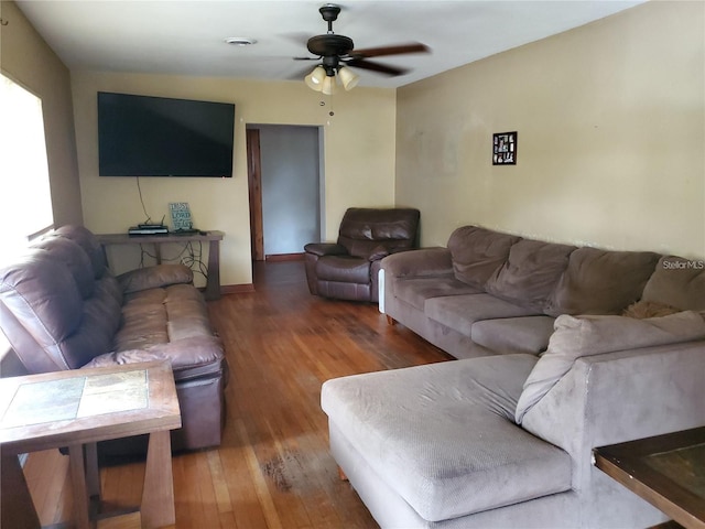 living room with hardwood / wood-style flooring and ceiling fan