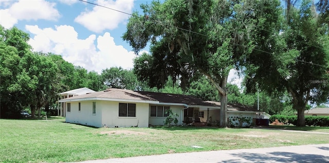 ranch-style house with a front yard