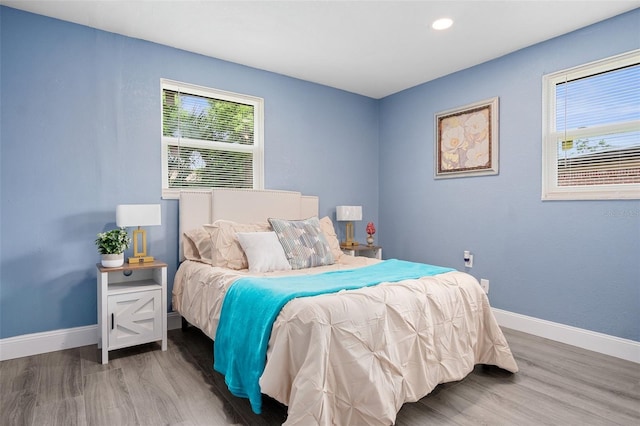 bedroom with dark wood-type flooring