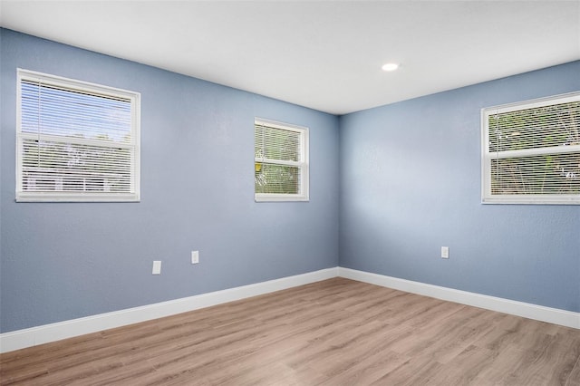 unfurnished room featuring light hardwood / wood-style flooring