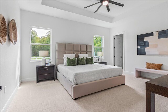 bedroom with light colored carpet and ceiling fan