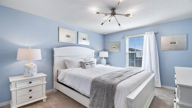 carpeted bedroom with a textured ceiling