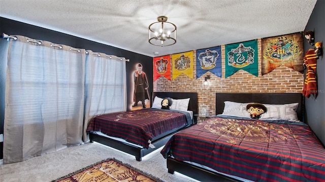 bedroom with carpet, an inviting chandelier, and a textured ceiling