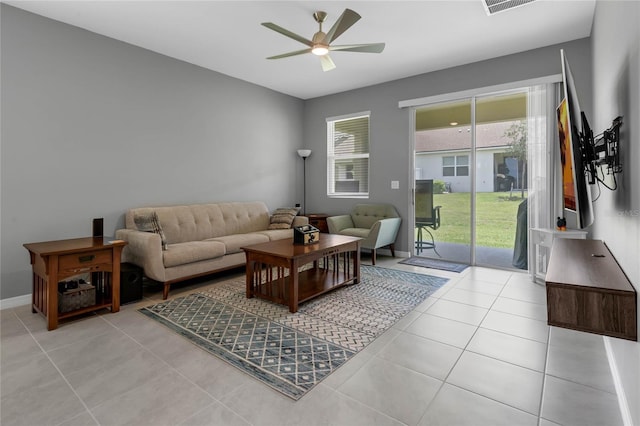 living room featuring ceiling fan and light tile patterned flooring