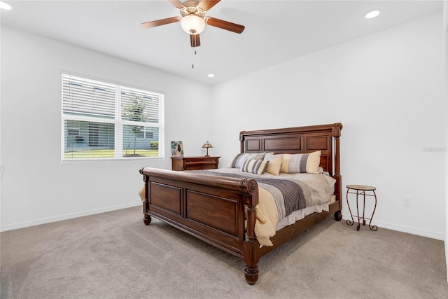 bedroom with ceiling fan and light colored carpet