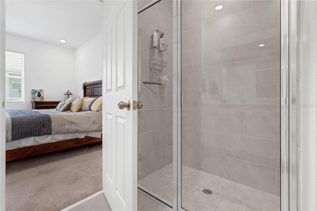 bathroom featuring a shower with door