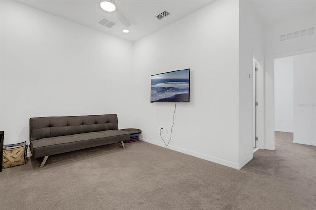 sitting room with light colored carpet