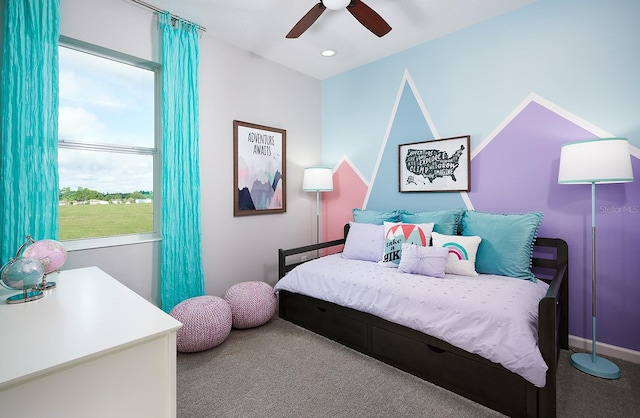 carpeted bedroom with ceiling fan