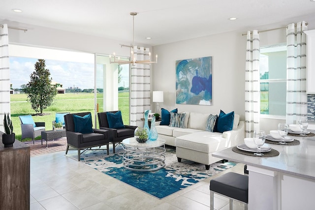 tiled living room featuring an inviting chandelier