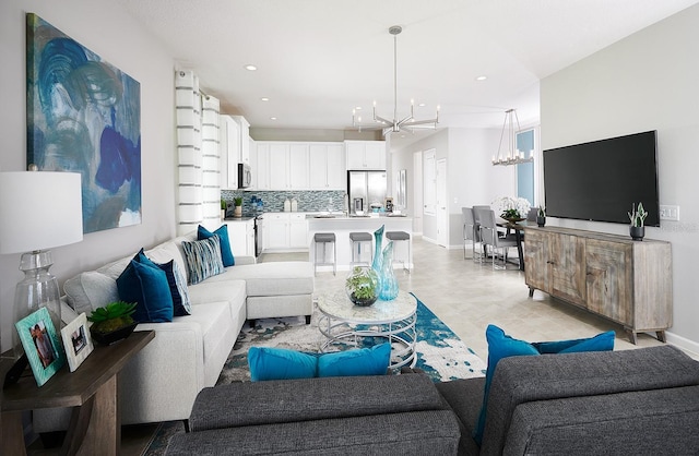 living room with a notable chandelier