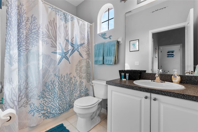 bathroom featuring vanity, tile patterned flooring, curtained shower, and toilet