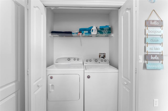 laundry area featuring washing machine and clothes dryer