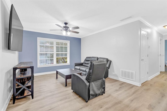 living area featuring ceiling fan, light hardwood / wood-style flooring, and crown molding