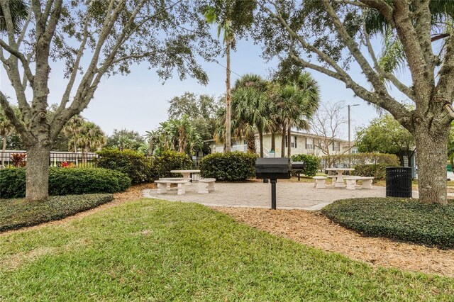 view of community with a patio area and a yard