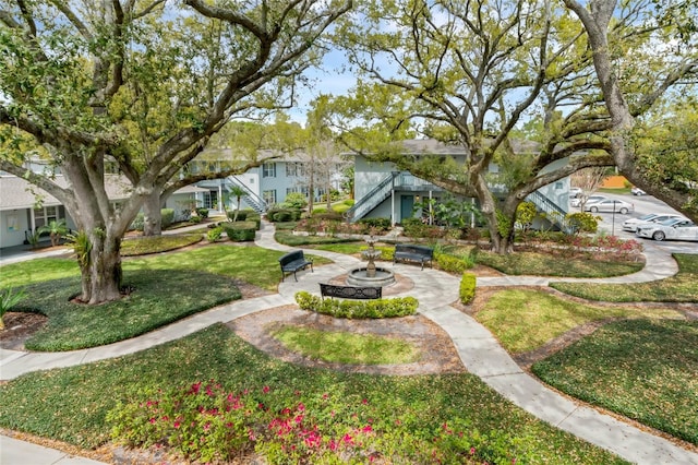 view of home's community featuring a yard