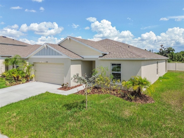 ranch-style home featuring a garage and a front lawn