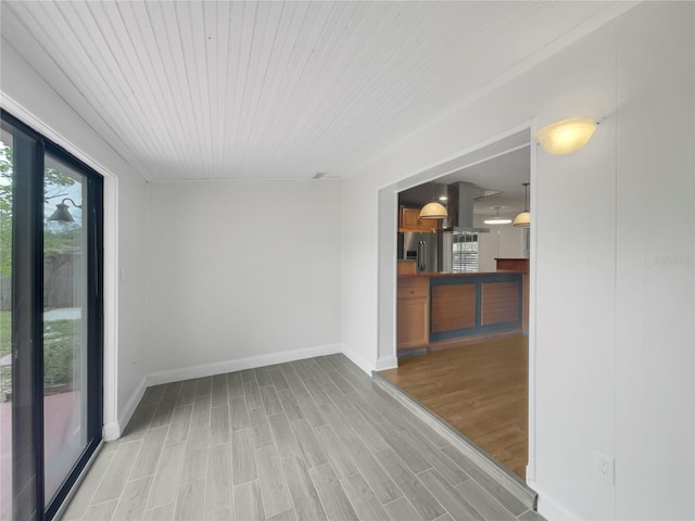 spare room featuring light wood-type flooring