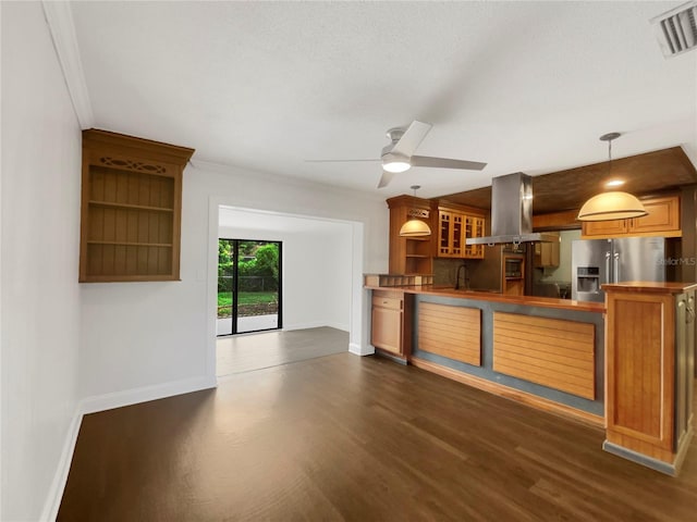 kitchen with decorative light fixtures, stainless steel fridge with ice dispenser, island range hood, crown molding, and dark wood-type flooring