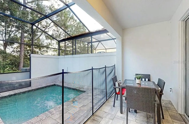 view of swimming pool featuring a lanai and a patio area