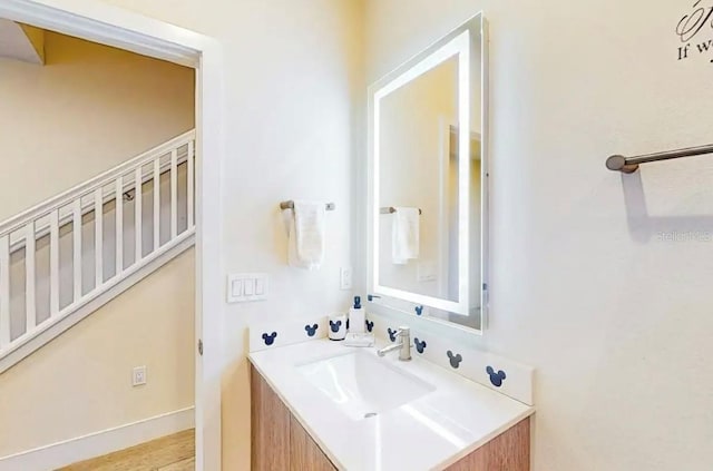 bathroom with vanity and wood-type flooring