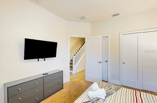 bedroom featuring light carpet