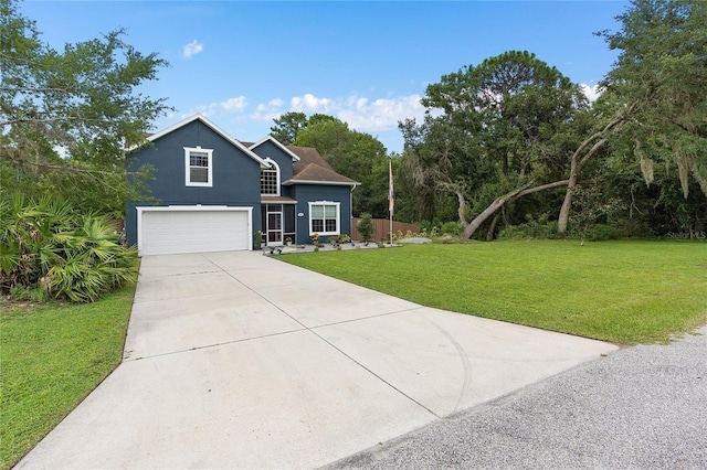 view of front of home with a garage and a front yard