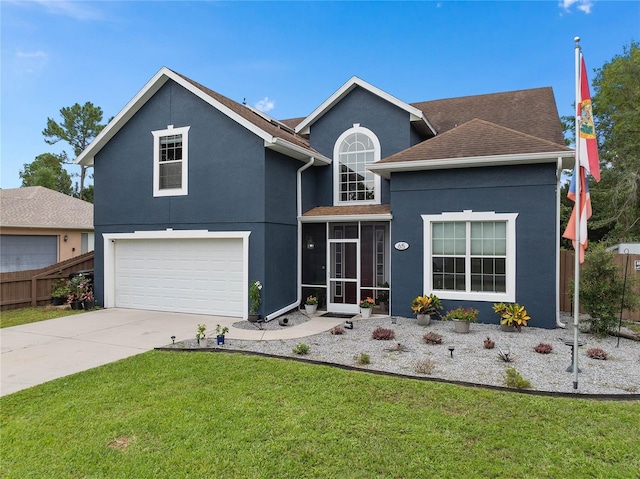 view of front of house featuring a garage, a sunroom, and a front yard