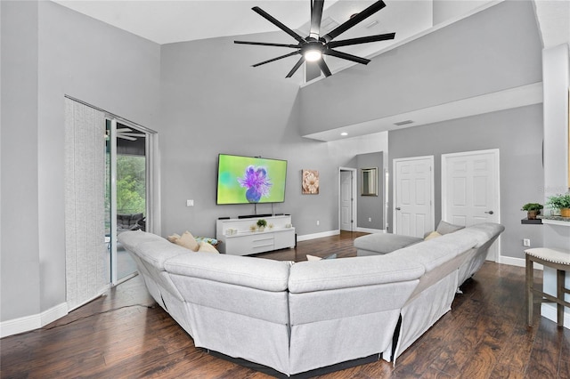 living room featuring ceiling fan, dark hardwood / wood-style flooring, and high vaulted ceiling