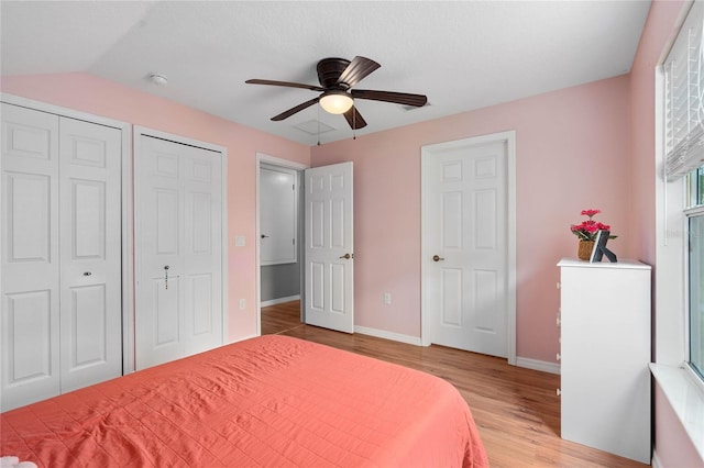 bedroom with light hardwood / wood-style floors and ceiling fan