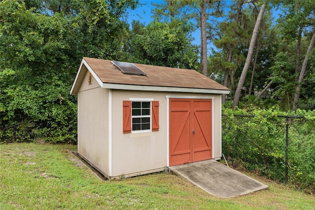 view of outdoor structure with a yard