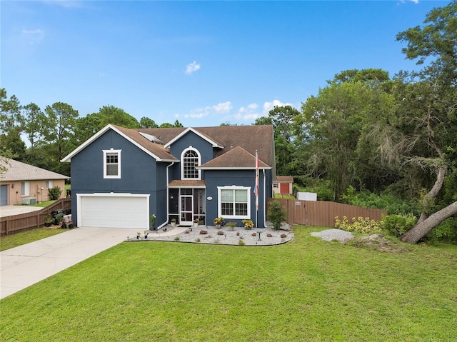 view of front of property with a garage and a front lawn