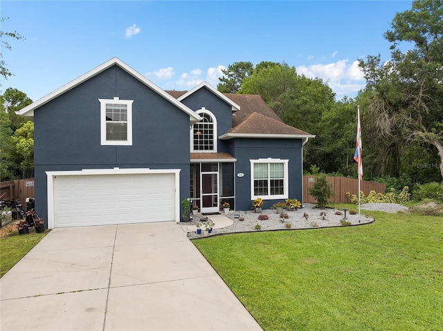 view of front property featuring a garage and a front yard