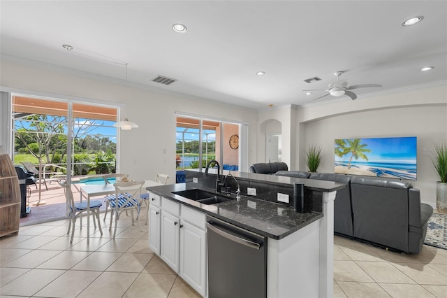 kitchen featuring dishwasher, sink, white cabinetry, and light tile patterned floors