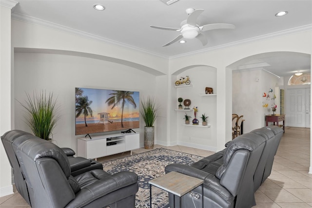 living room with ceiling fan, light tile patterned flooring, and ornamental molding