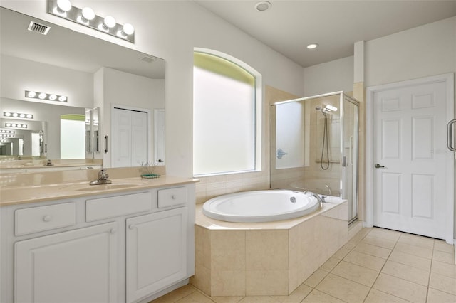 bathroom with vanity, independent shower and bath, and tile patterned flooring